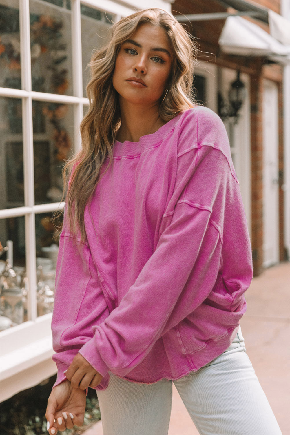 Rose Exposed Seam Twist Open Back Oversized Sweatshirt - Premium Tops from Momma Done Gone Crafty- Just $36.99! Shop now at Momma Done Gone Crafty
