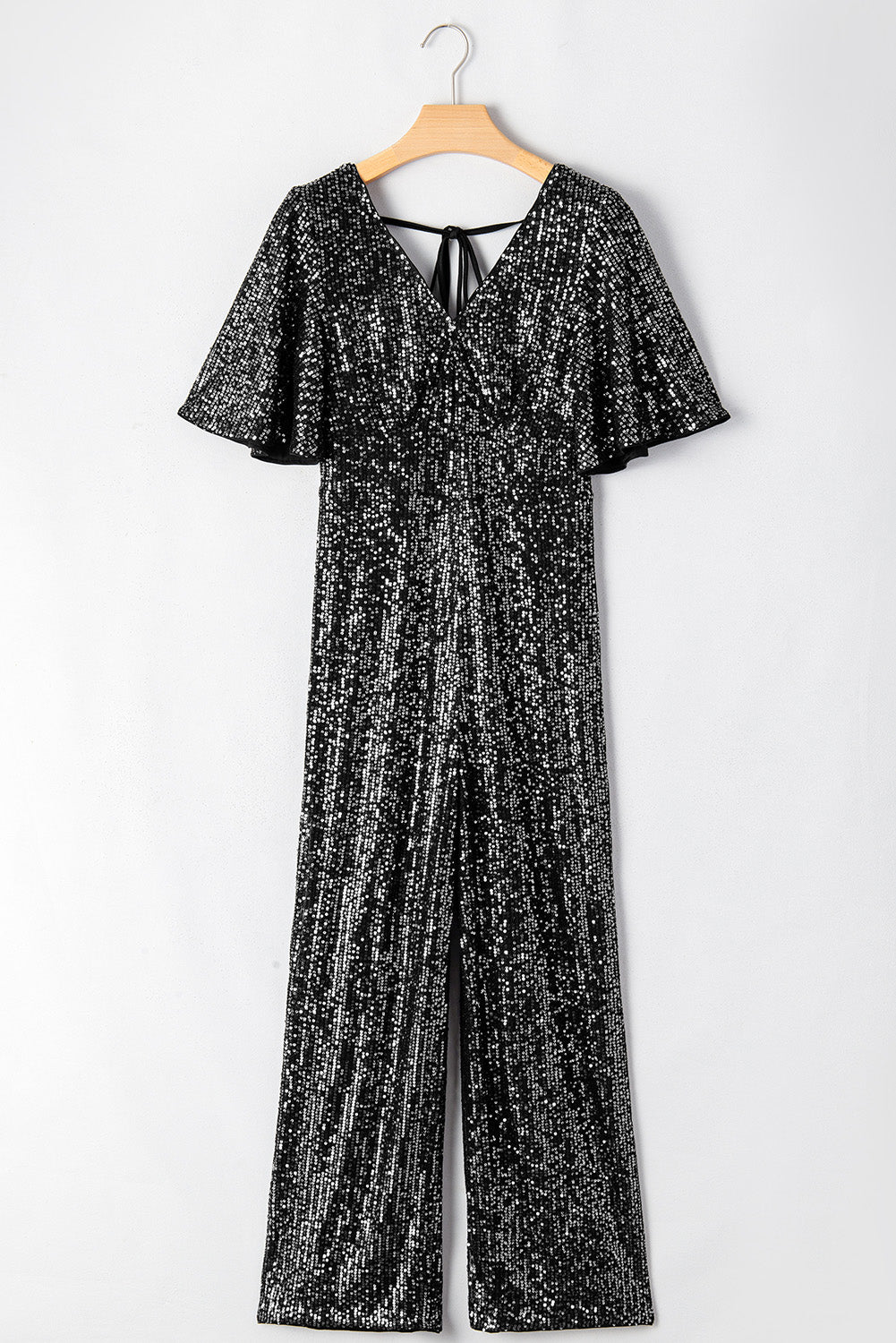 Black Sequin V Neck Flutter Sleeve Wide Leg Jumpsuit - Premium Bottoms/Jumpsuits & Rompers from Ashes 2 Wildflowers Boutique, LLC- Just $53.10! Shop now at Ashes 2 Wildflowers Boutique, LLC
