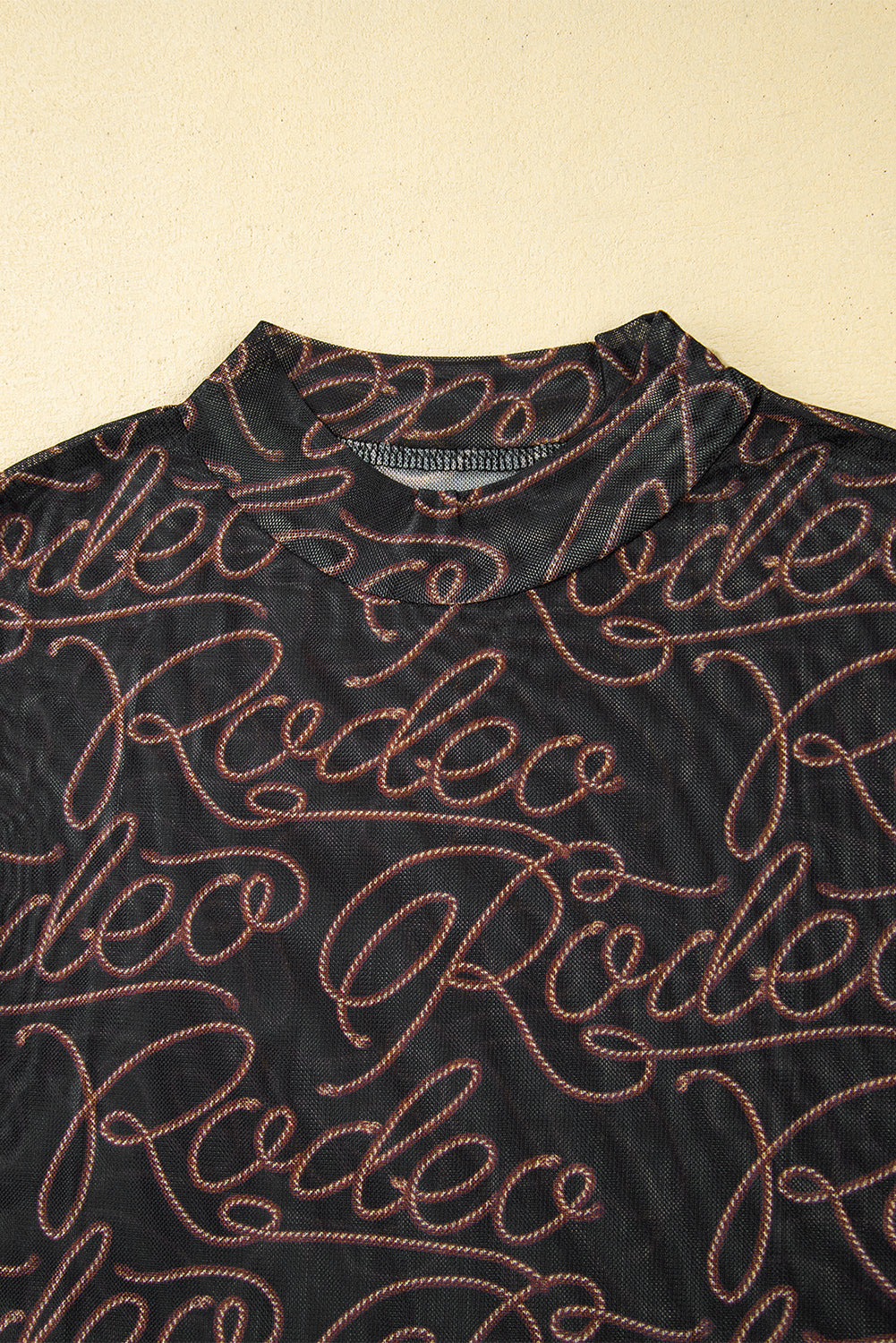 Black Western Rodeo Printed Mock Neck Long Sleeve Mesh Top - Premium Tops/Long Sleeve Tops from Ashes 2 Wildflowers Boutique, LLC- Just $24.65! Shop now at Ashes 2 Wildflowers Boutique, LLC